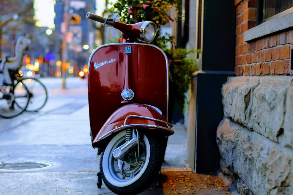 Photo by Tim Gouw: https://www.pexels.com/photo/red-piaggio-vespa-motor-scooter-parked-beside-gray-and-red-concrete-building-240222/

Conclusion